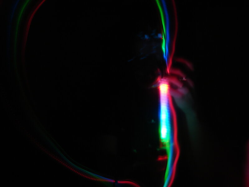 colorful light trails in darkness