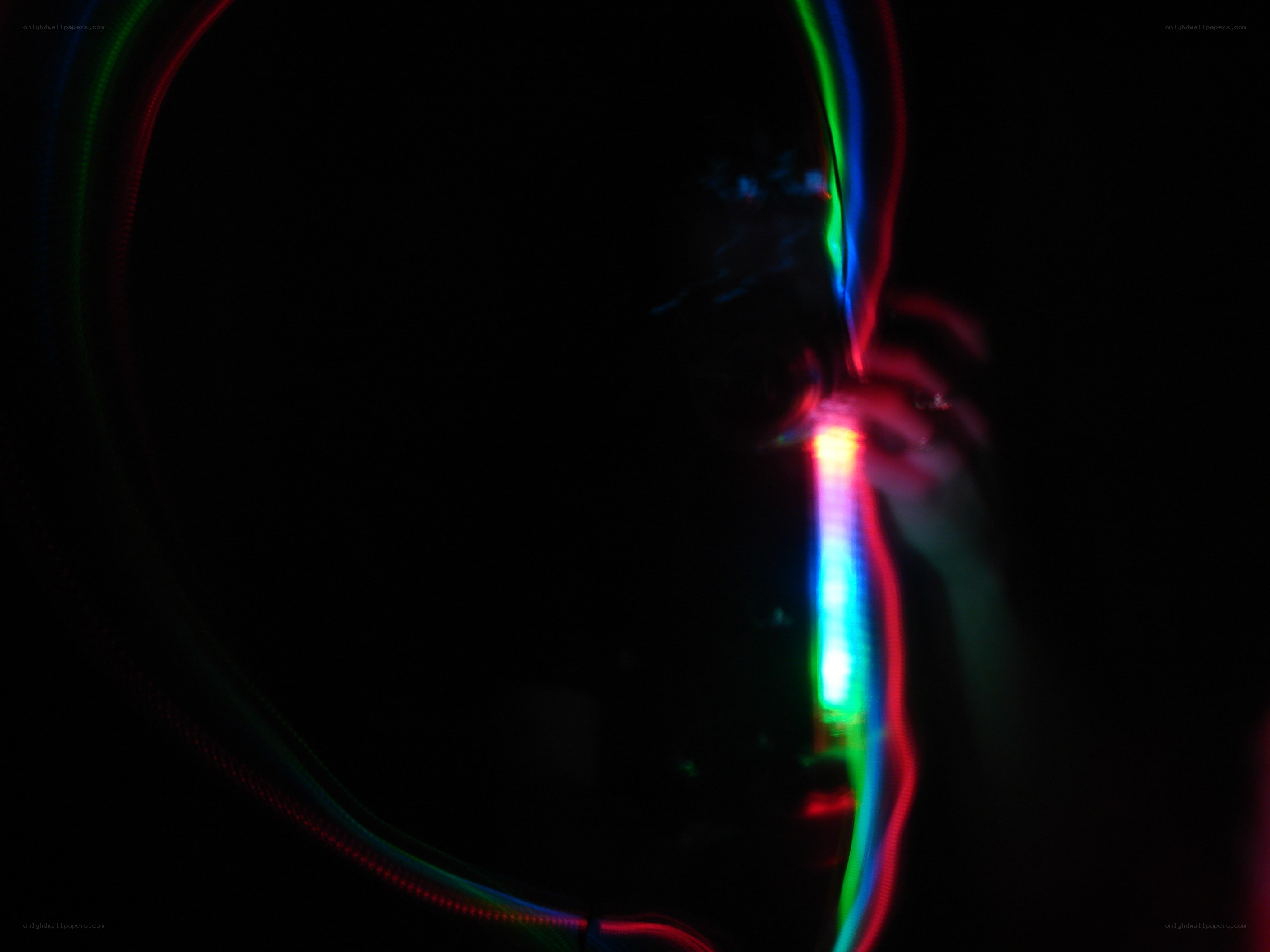 colorful light trails in darkness