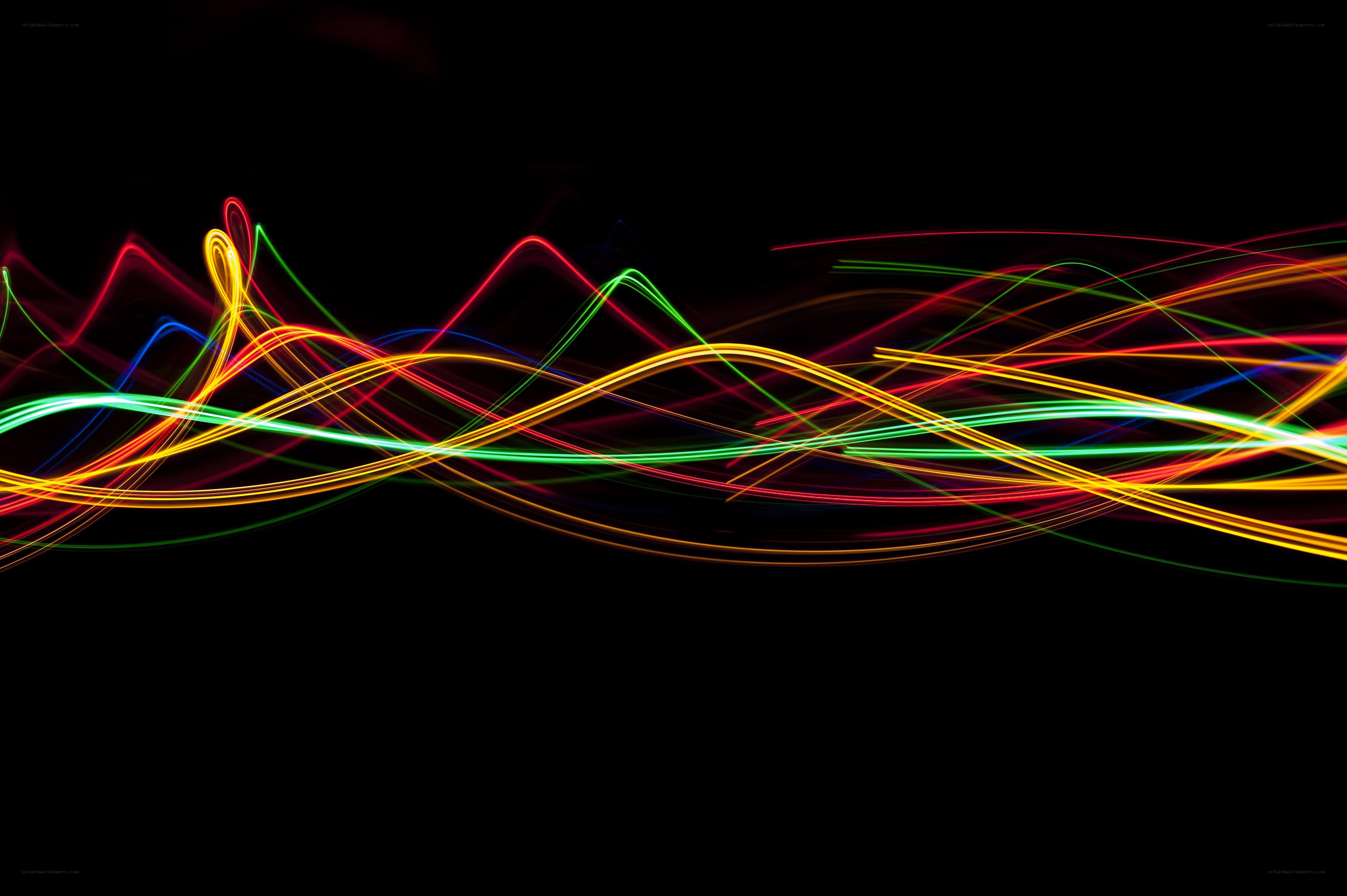Colorful light trails on black