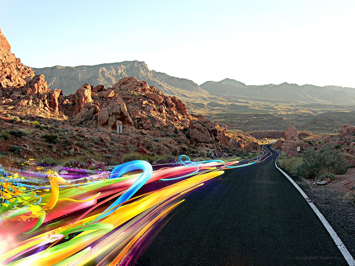 Colorful light trails on desert road