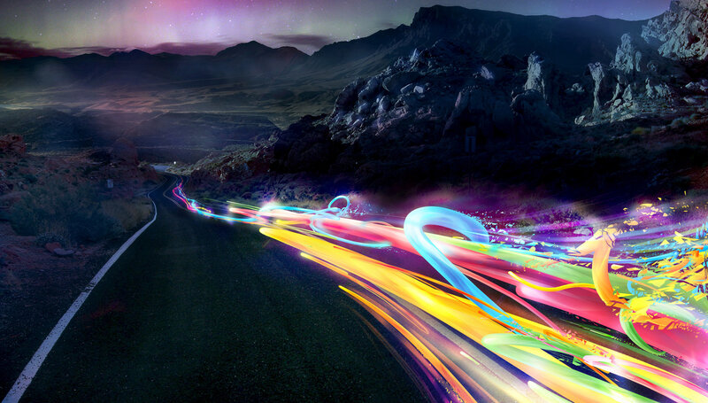 Colorful light trails on desert road