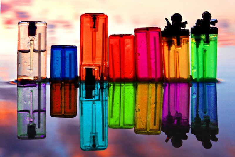Colorful lighters on water