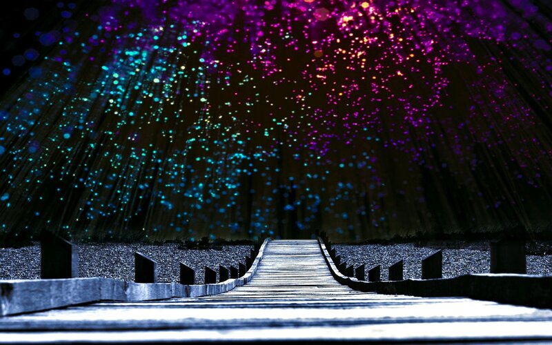 colorful lights on a wooden bridge