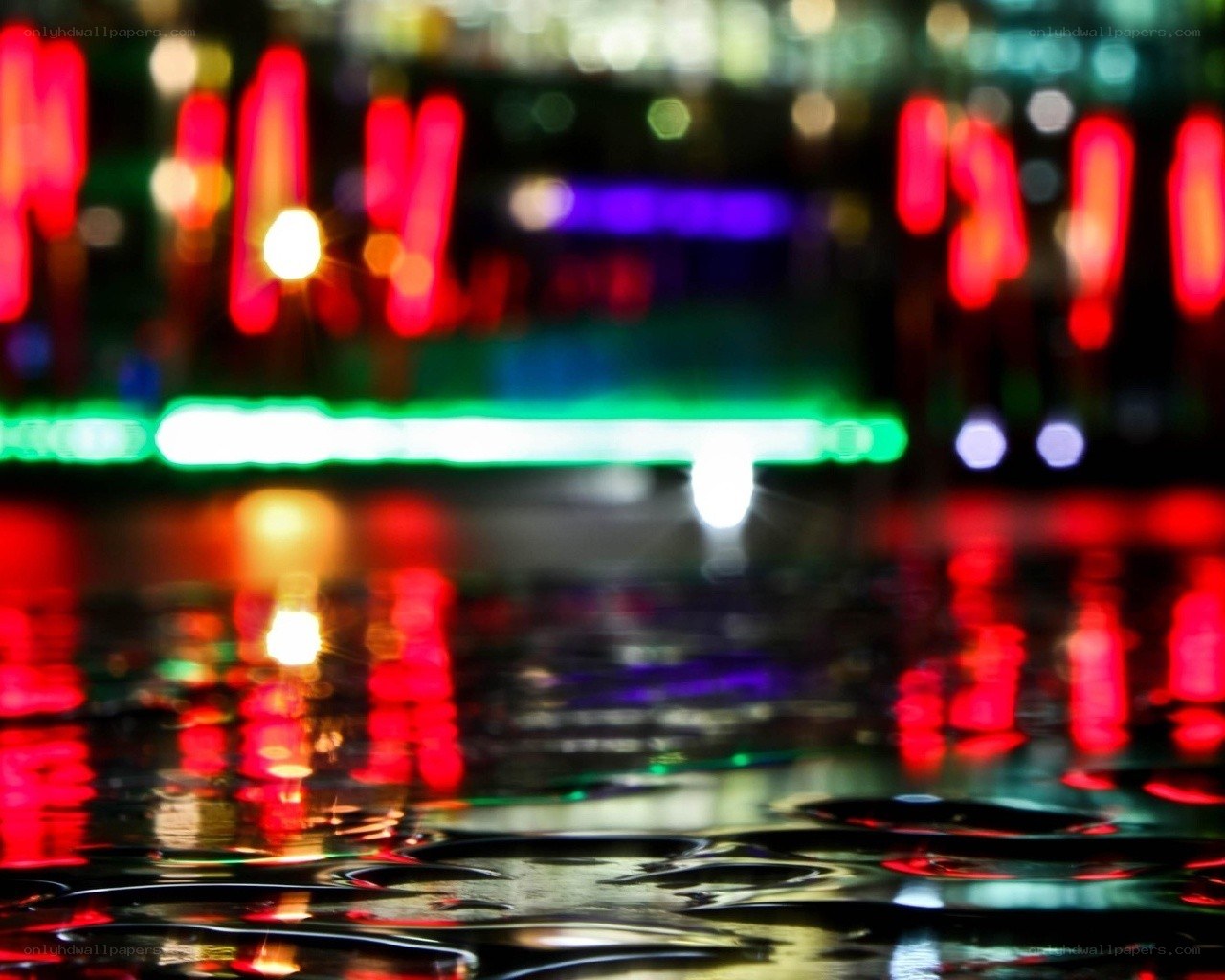 colorful lights on wet pavement