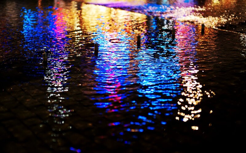 Colorful Lights on Wet Pavement — Blue