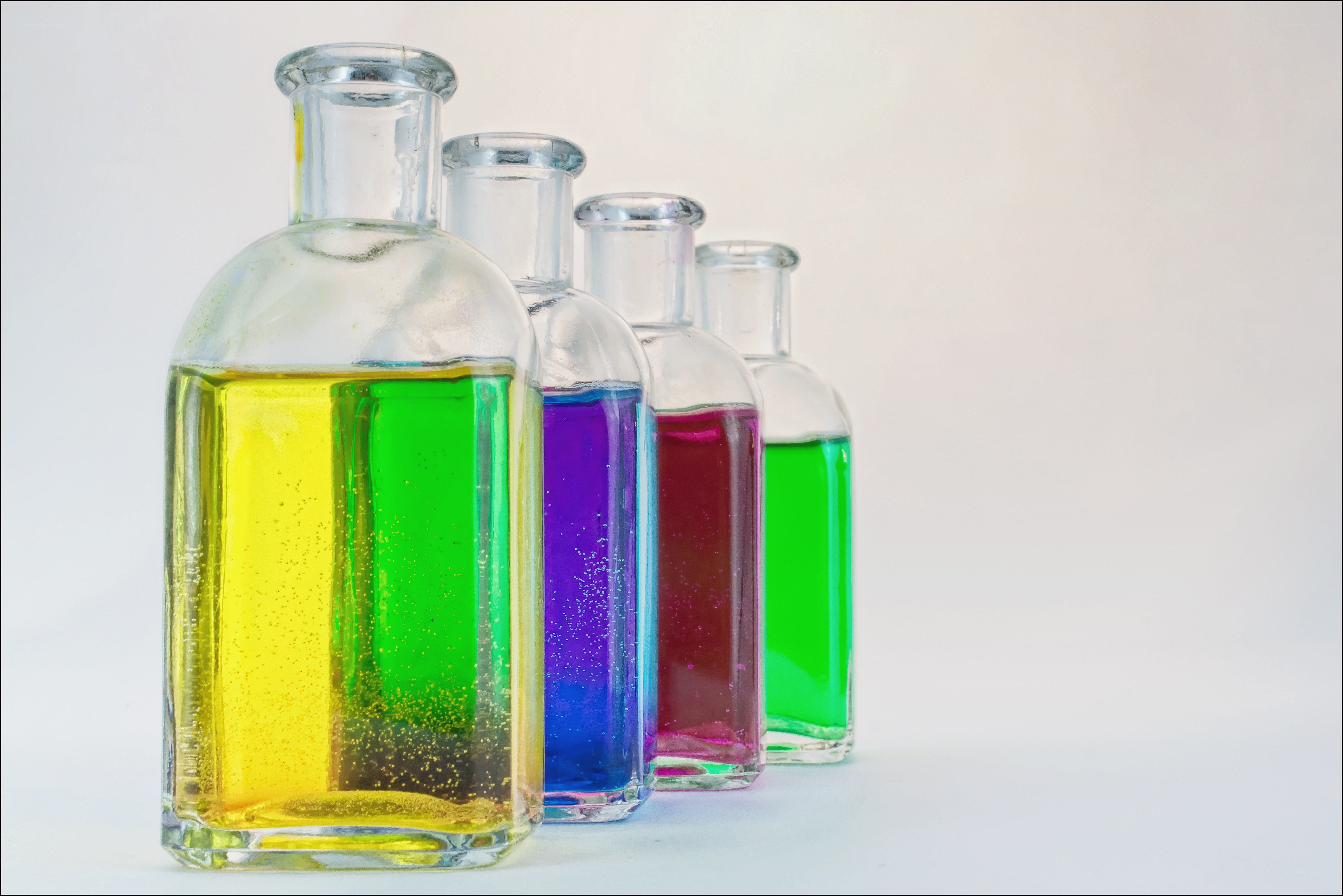 Colorful liquid bottles in a row