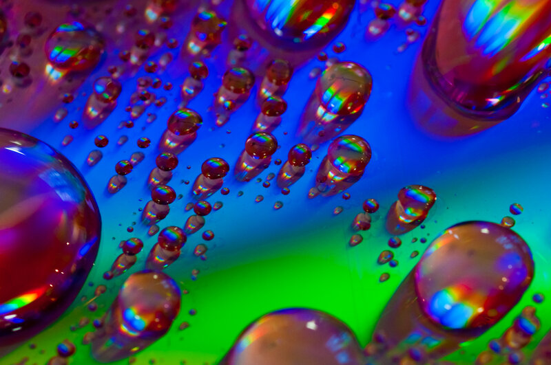 Colorful liquid bubbles on a gradient surface