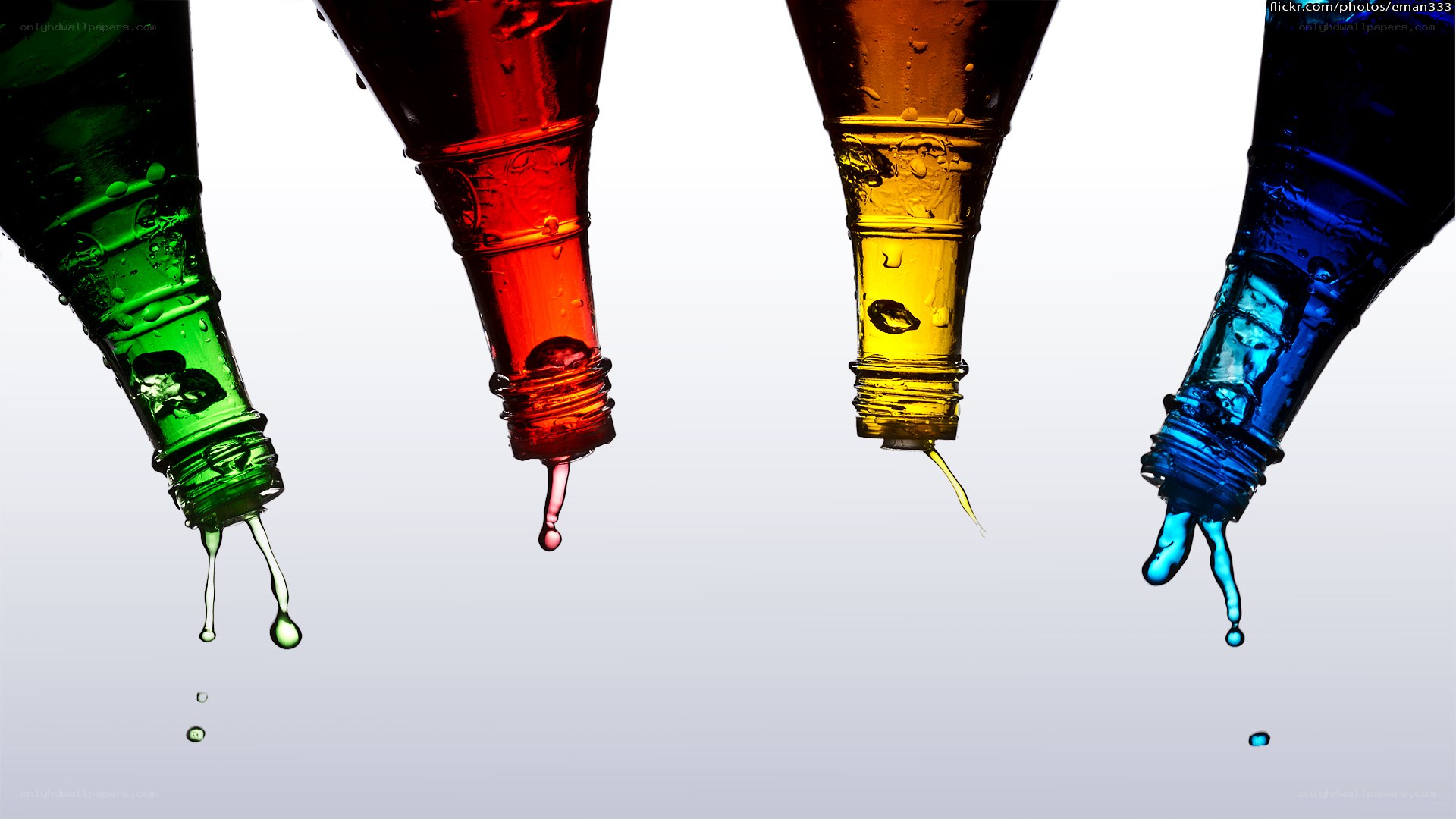 Colorful liquid drips from bottles