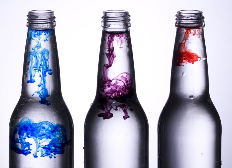 Colorful liquid in glass bottles