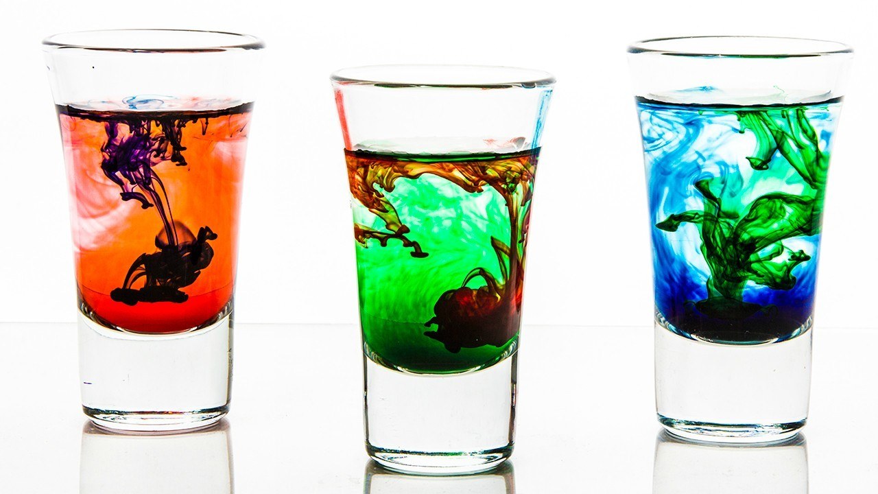 Colorful liquid in shot glasses