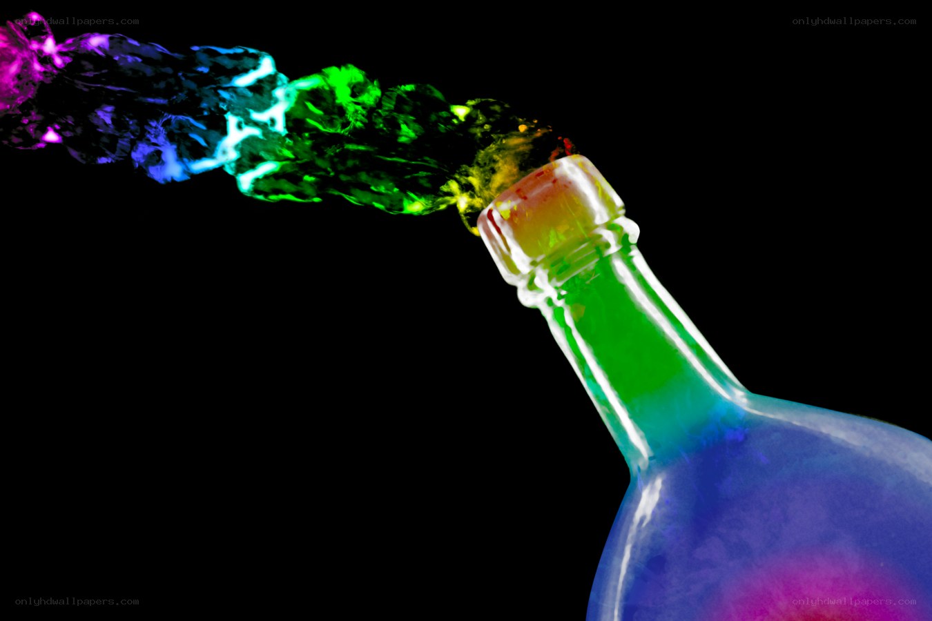 colorful liquid pouring from bottle