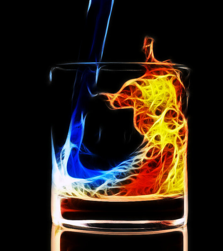 Colorful liquid pouring into glass