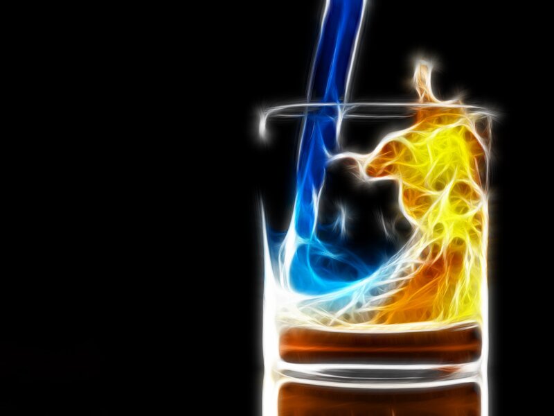 Colorful liquid pouring into glass