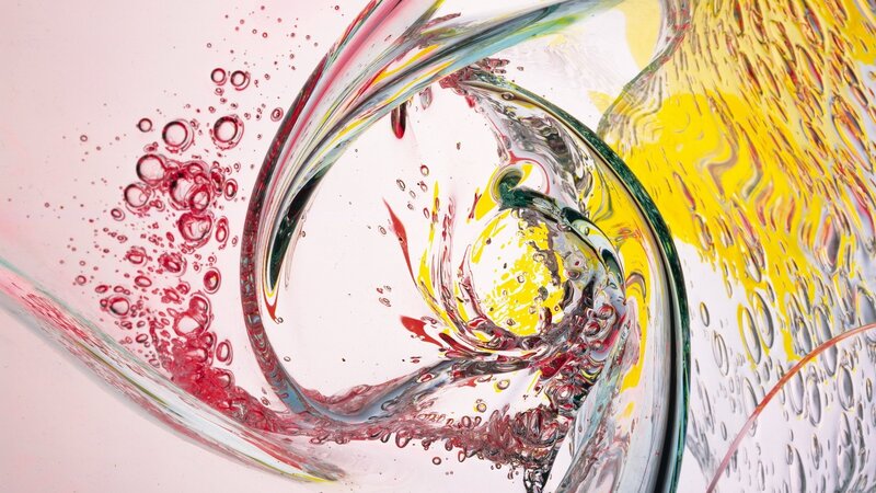 Colorful liquid swirl in glass