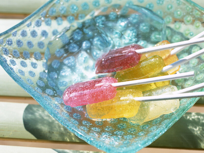 Colorful lollipops in a glass bowl