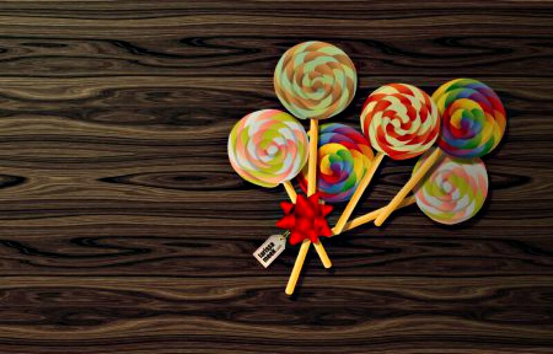 Colorful Lollipops on Wood
