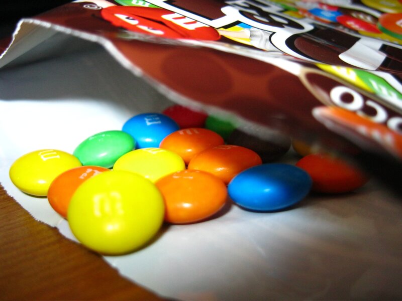 Colorful M&M's candies spilled