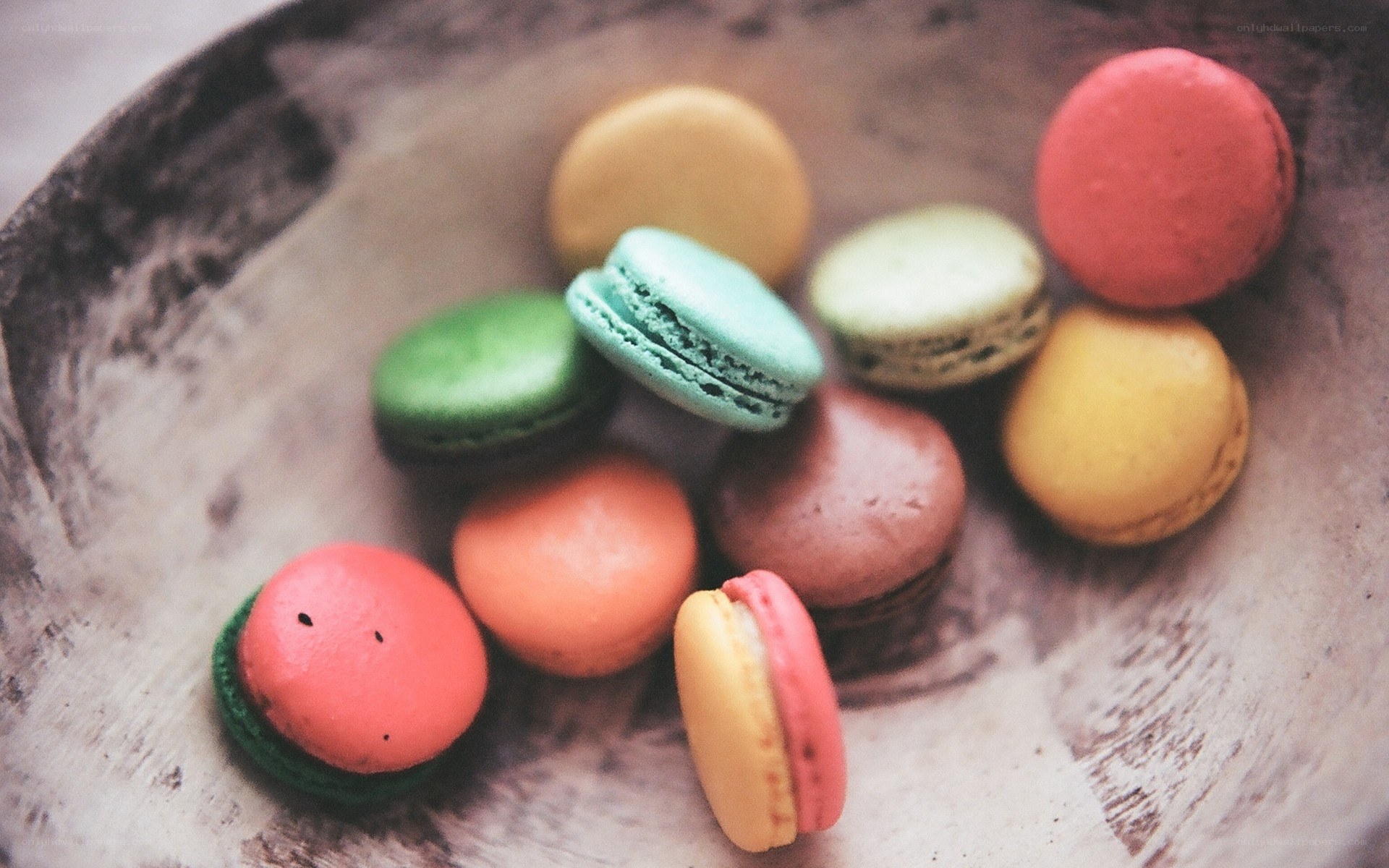 Colorful macarons in a bowl