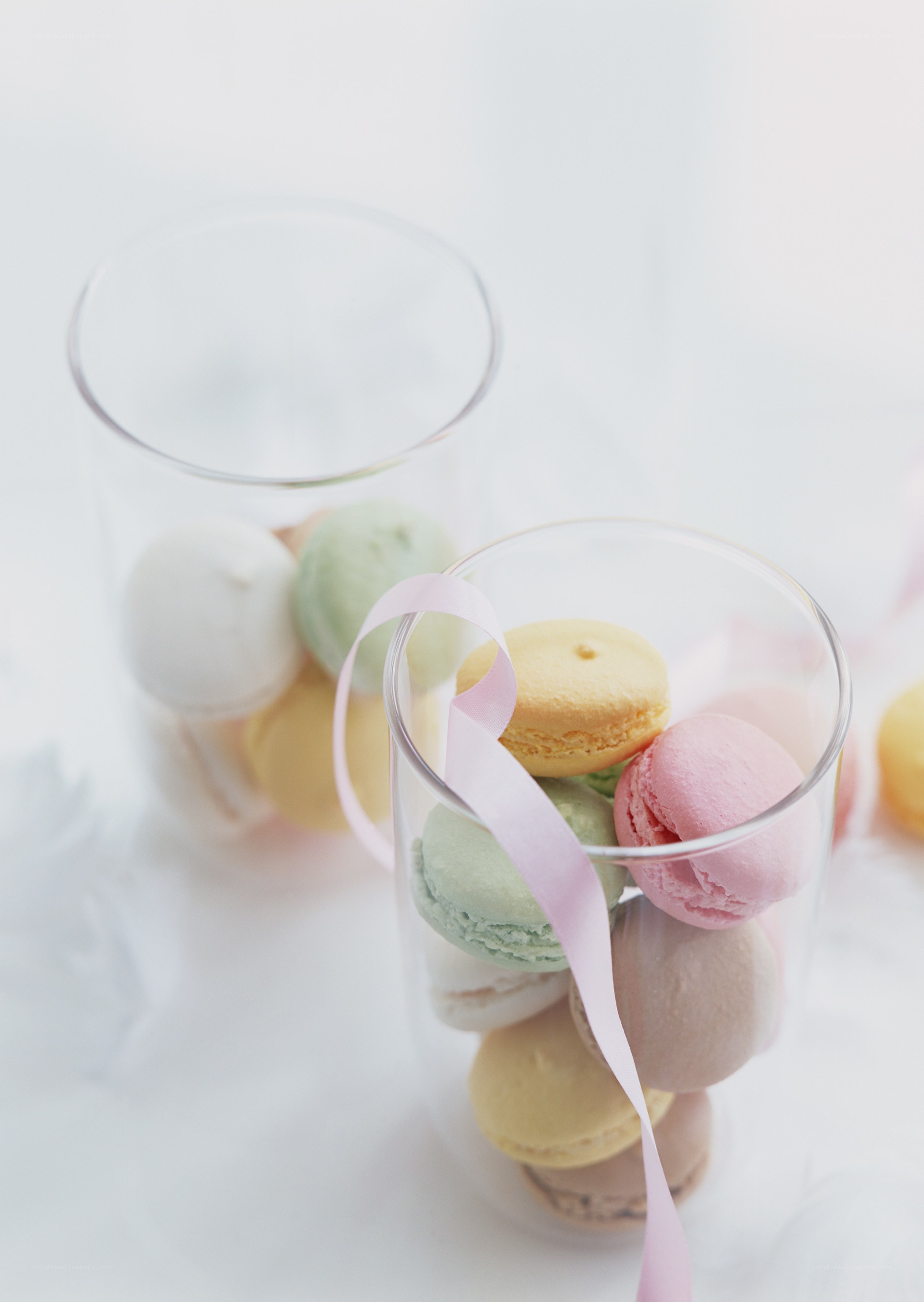 Colorful macarons in glass jars