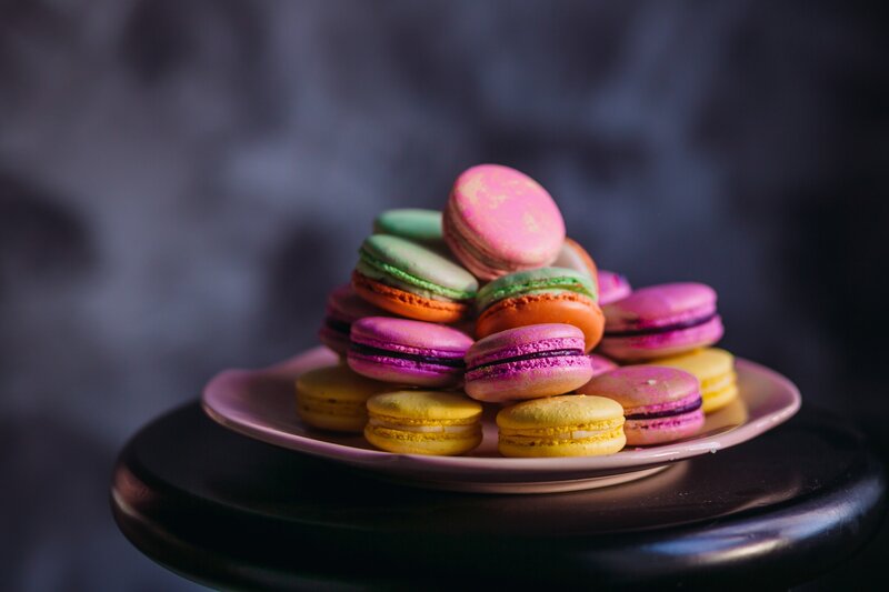 Colorful Macarons on Plate — Pink, Dramatic