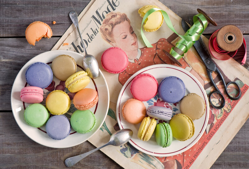 Colorful macarons on vintage magazine