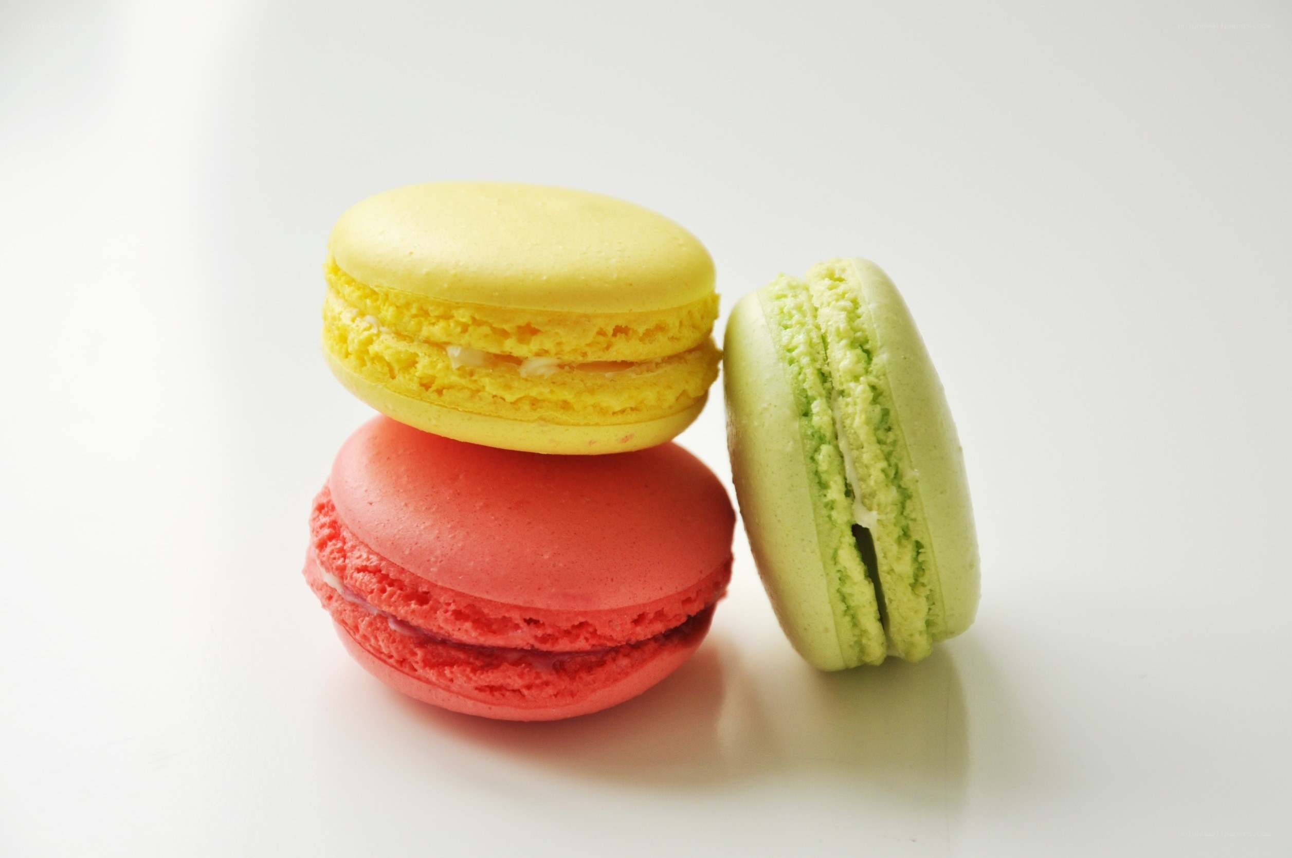 Colorful macarons on white