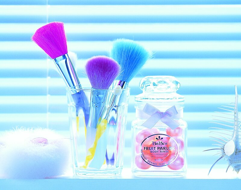 Colorful makeup brushes and body rinse