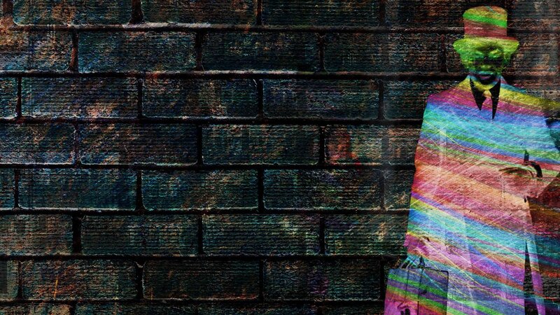 colorful man on brick wall