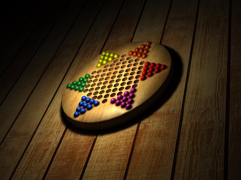 Colorful marble game on wood