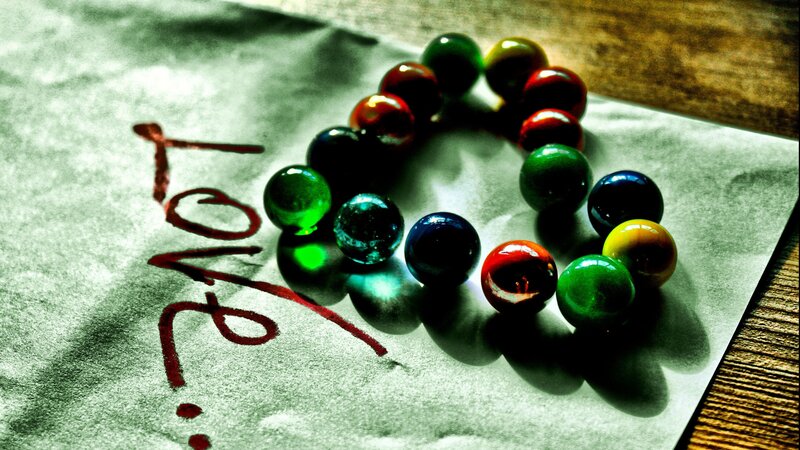 Colorful Marbles on Paper — Green, Dramatic