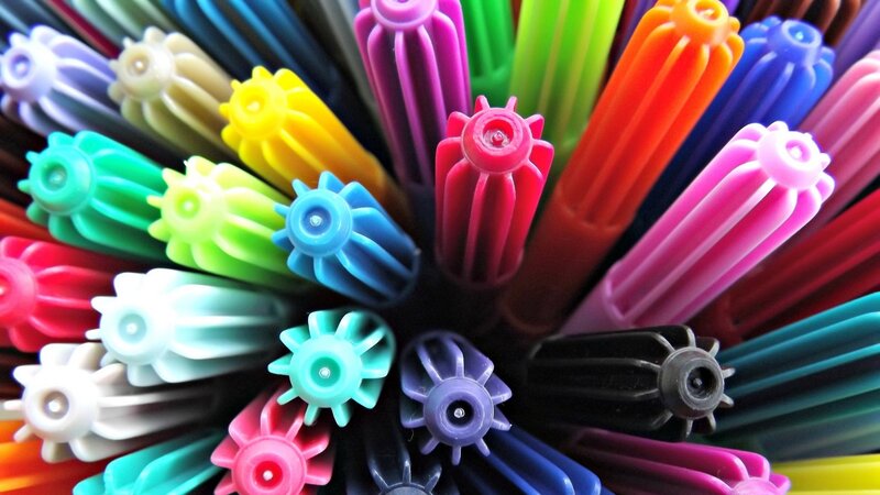 Colorful markers in a holder