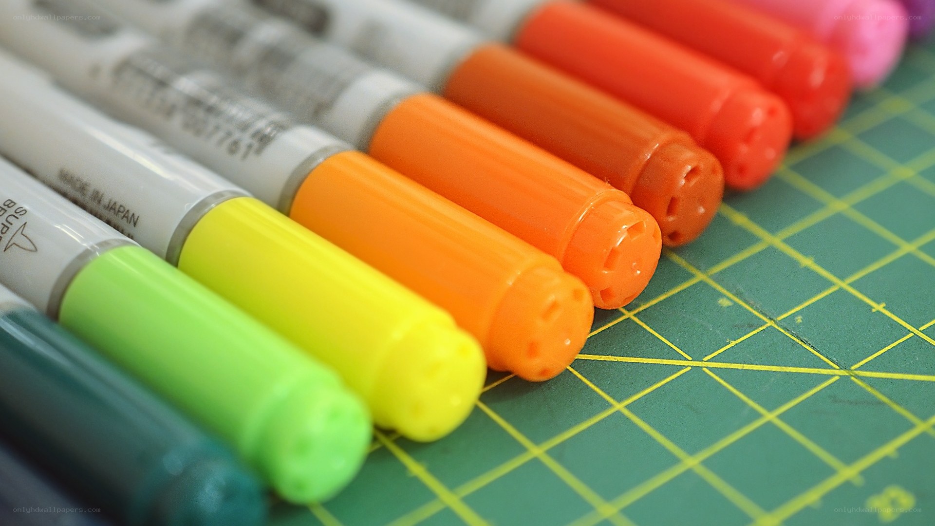 Colorful markers on cutting mat