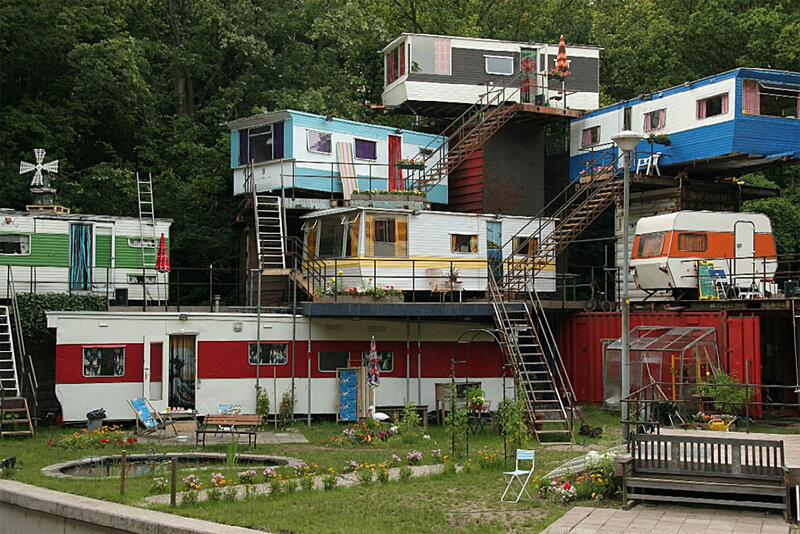 Colorful mobile homes stacked in garden