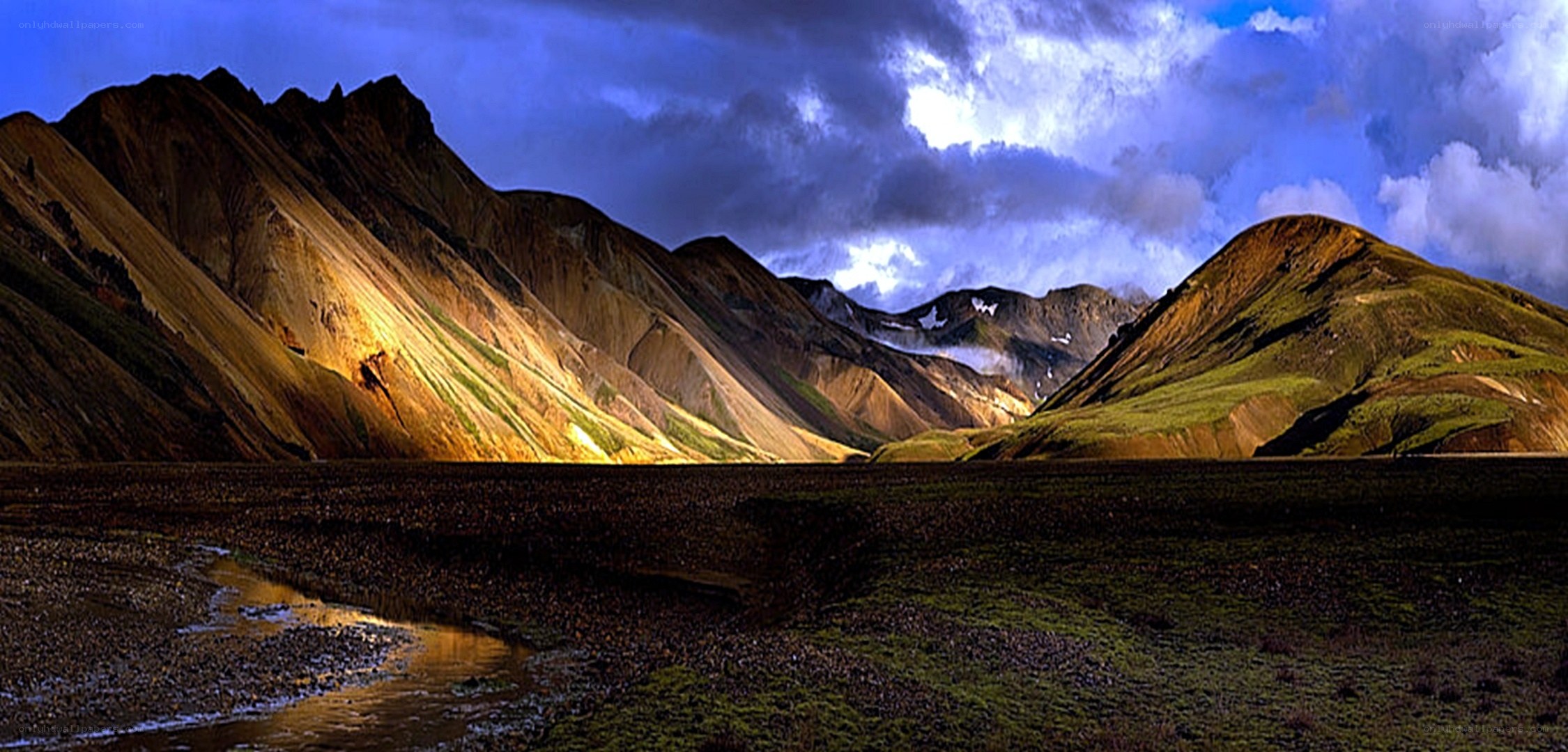 Colorful mountains under stormy sky