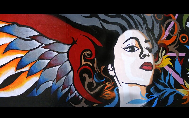 colorful mural of woman with wings