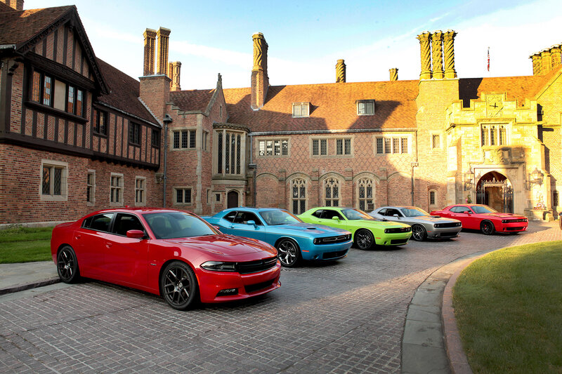 Colorful muscle cars in courtyard