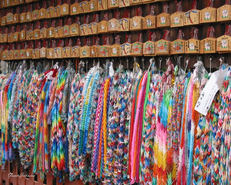 Colorful origami cranes at a shrine