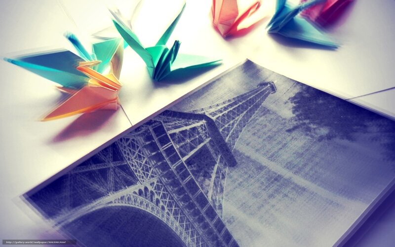 Colorful origami cranes on photo