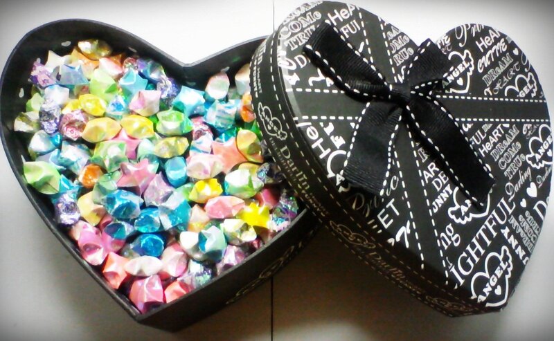 Colorful origami stars in heart box