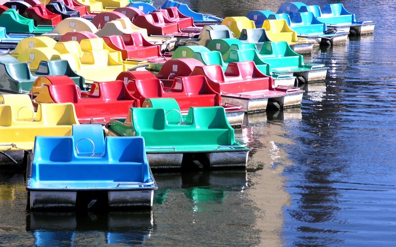 Colorful paddle boats at a lake