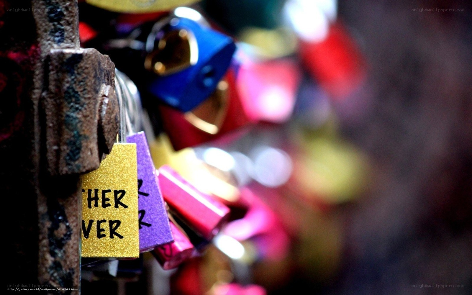 Colorful padlocks on a bridge