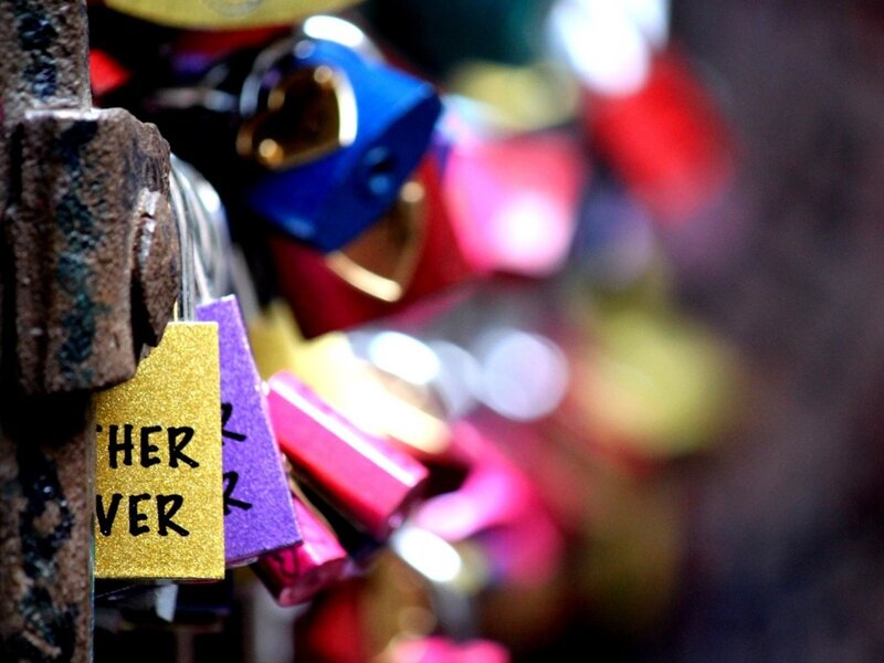 Colorful Padlocks on Bridge