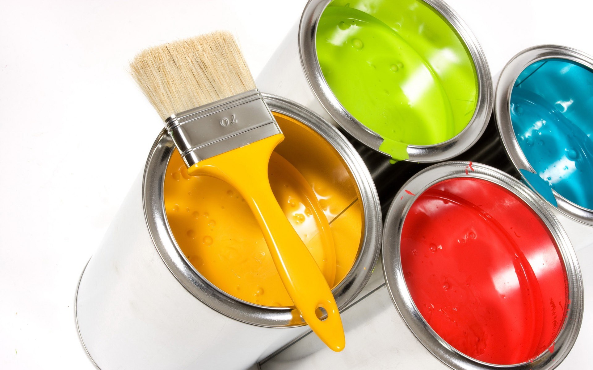 colorful paint cans and brush