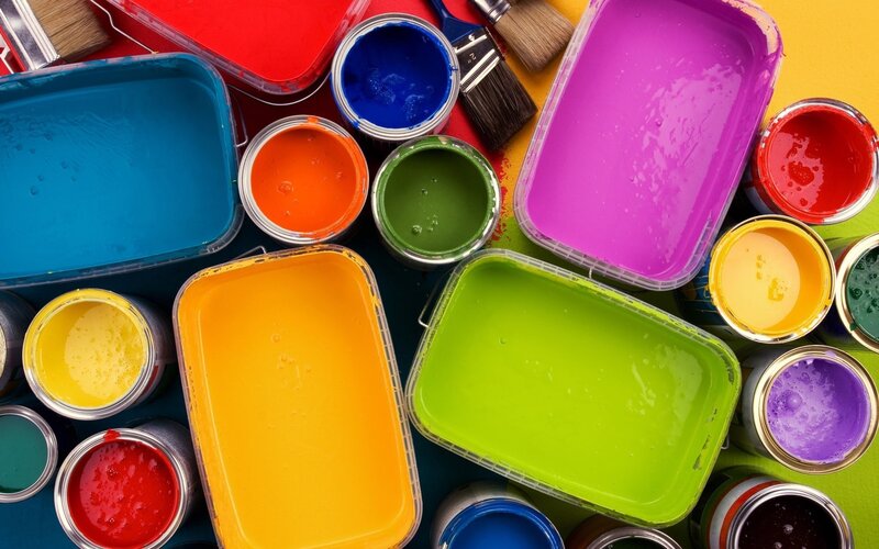 Colorful paint cans and trays