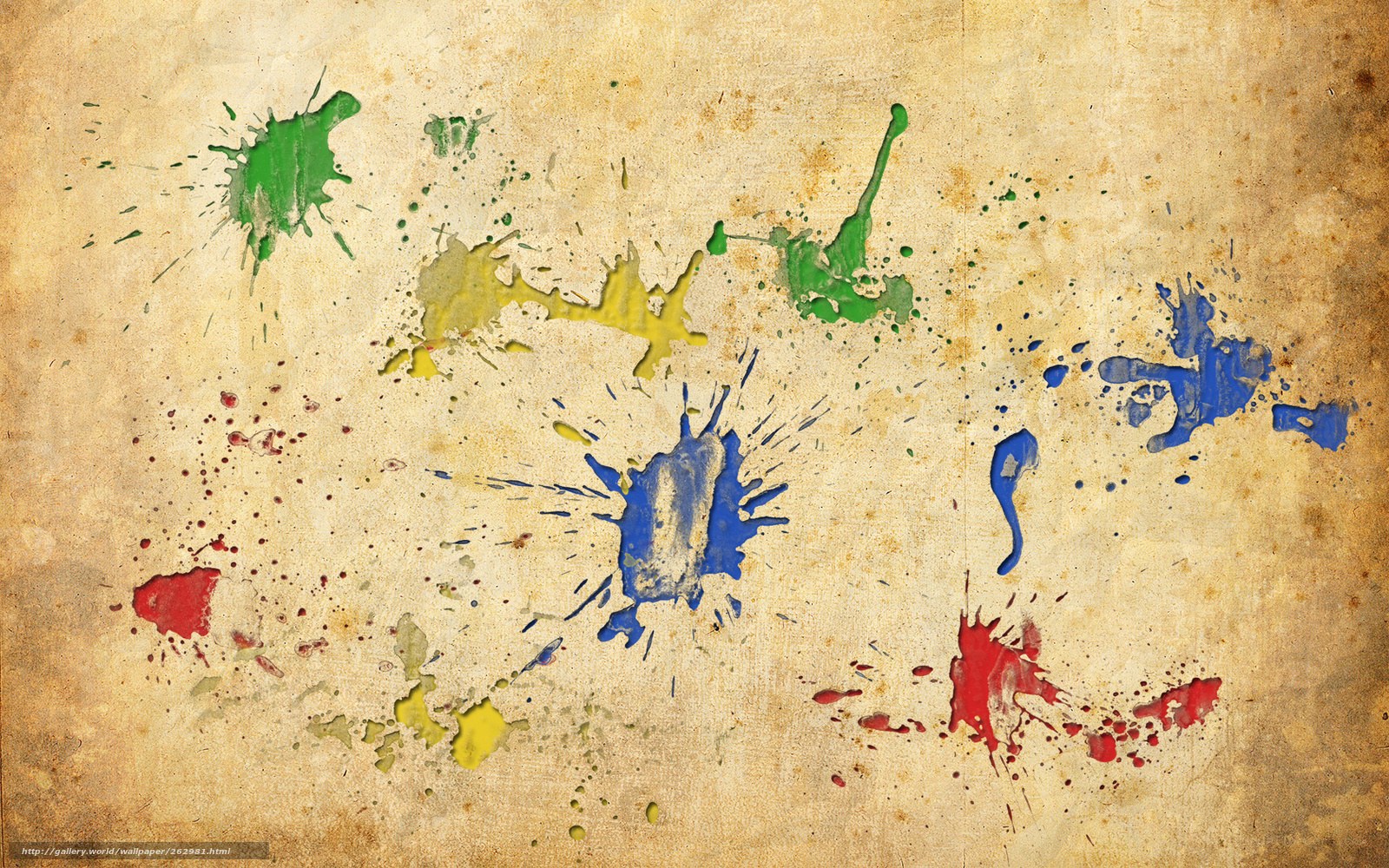 colorful paint splatters on old paper