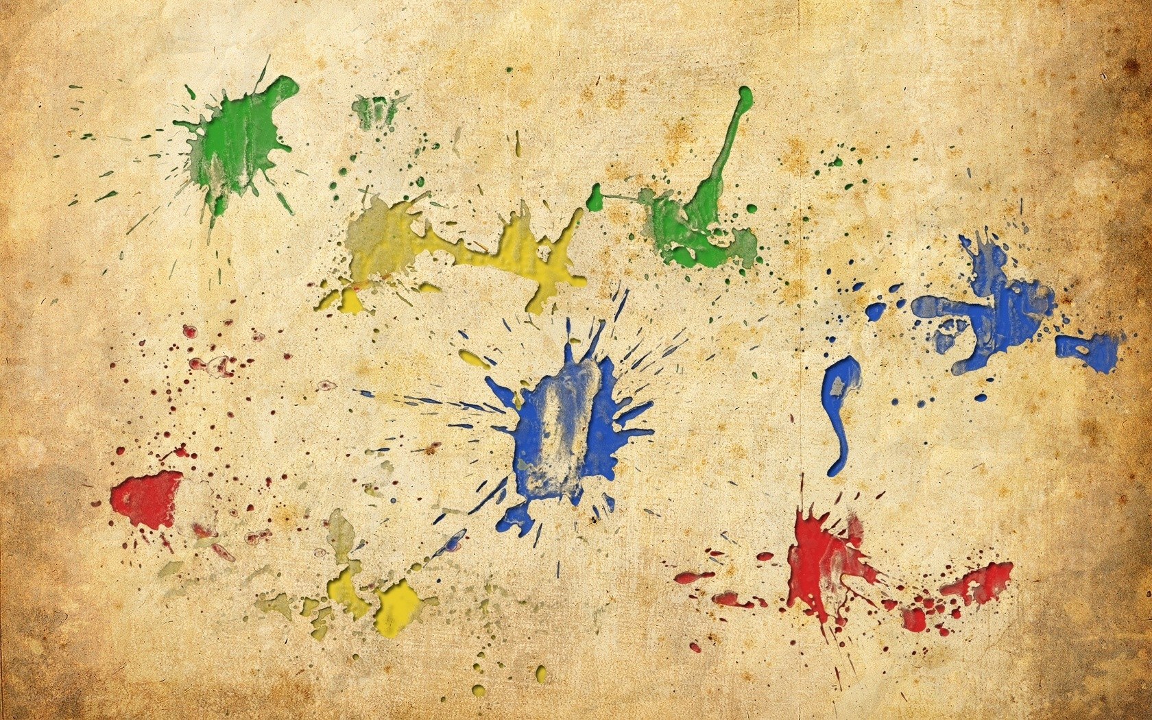 colorful paint splatters on old paper