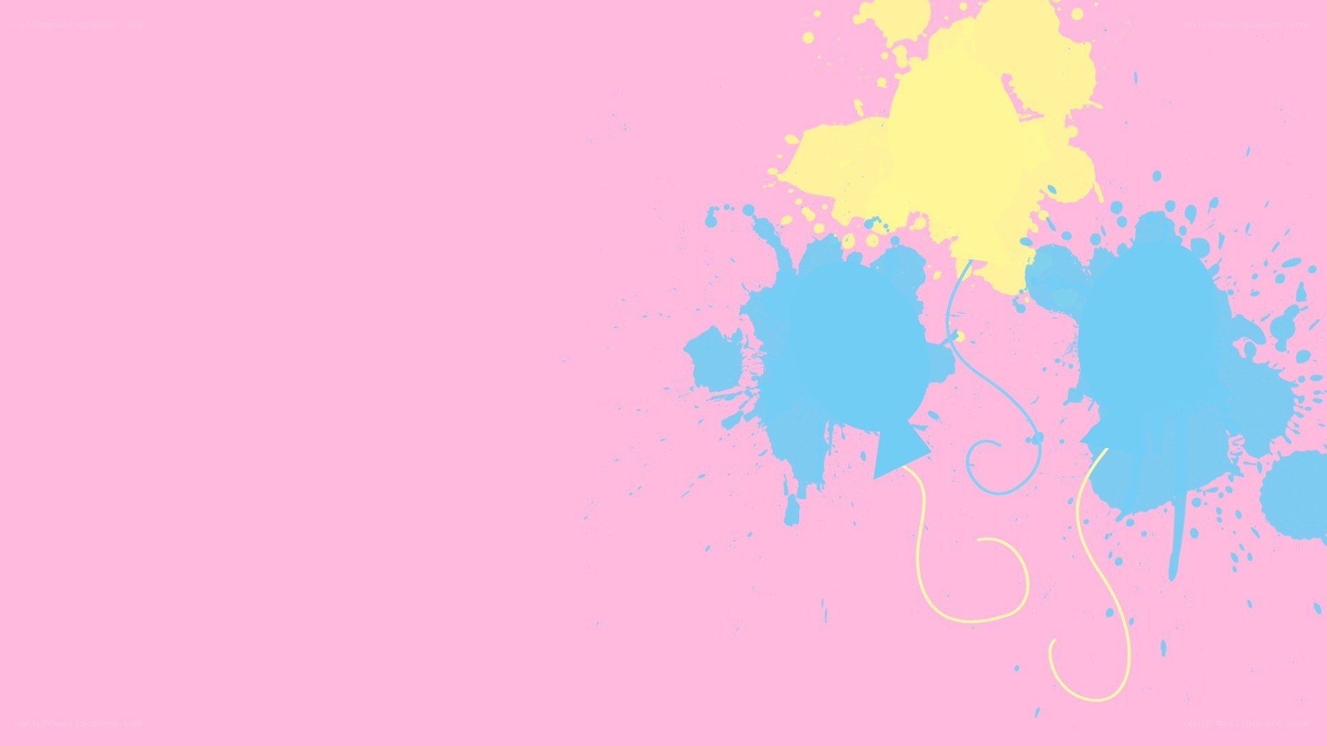 colorful paint splatters on pink