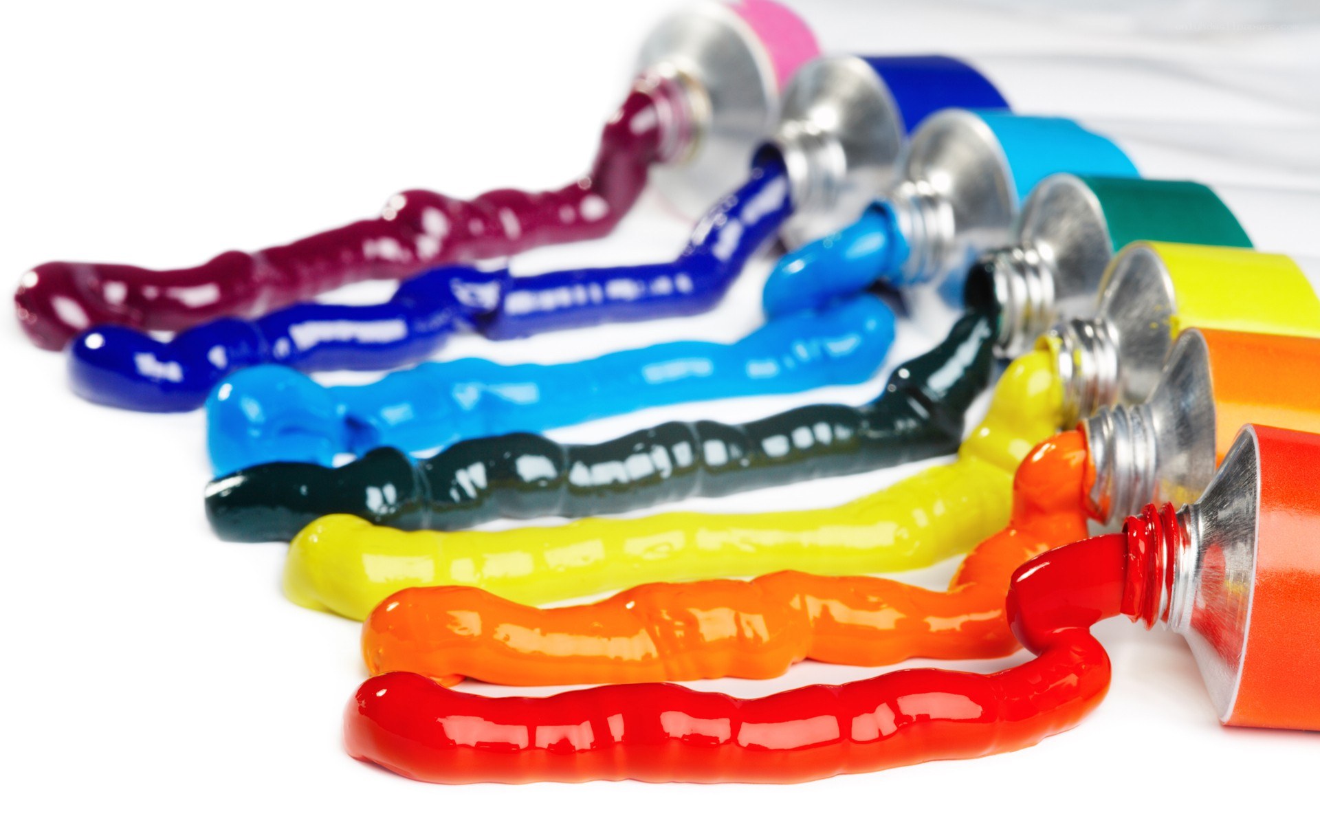 Colorful paint tubes in a row