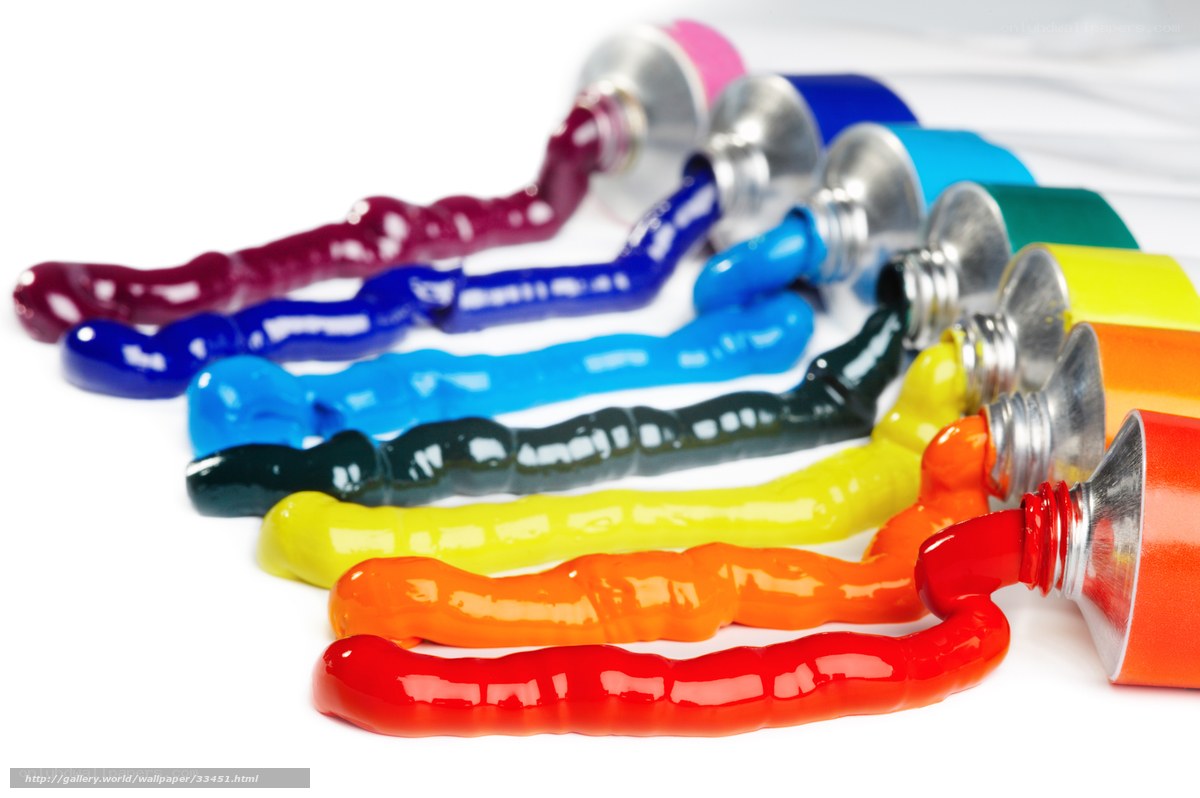 Colorful paint tubes on white