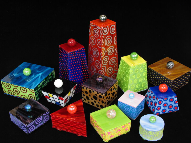 Colorful painted boxes with knobs